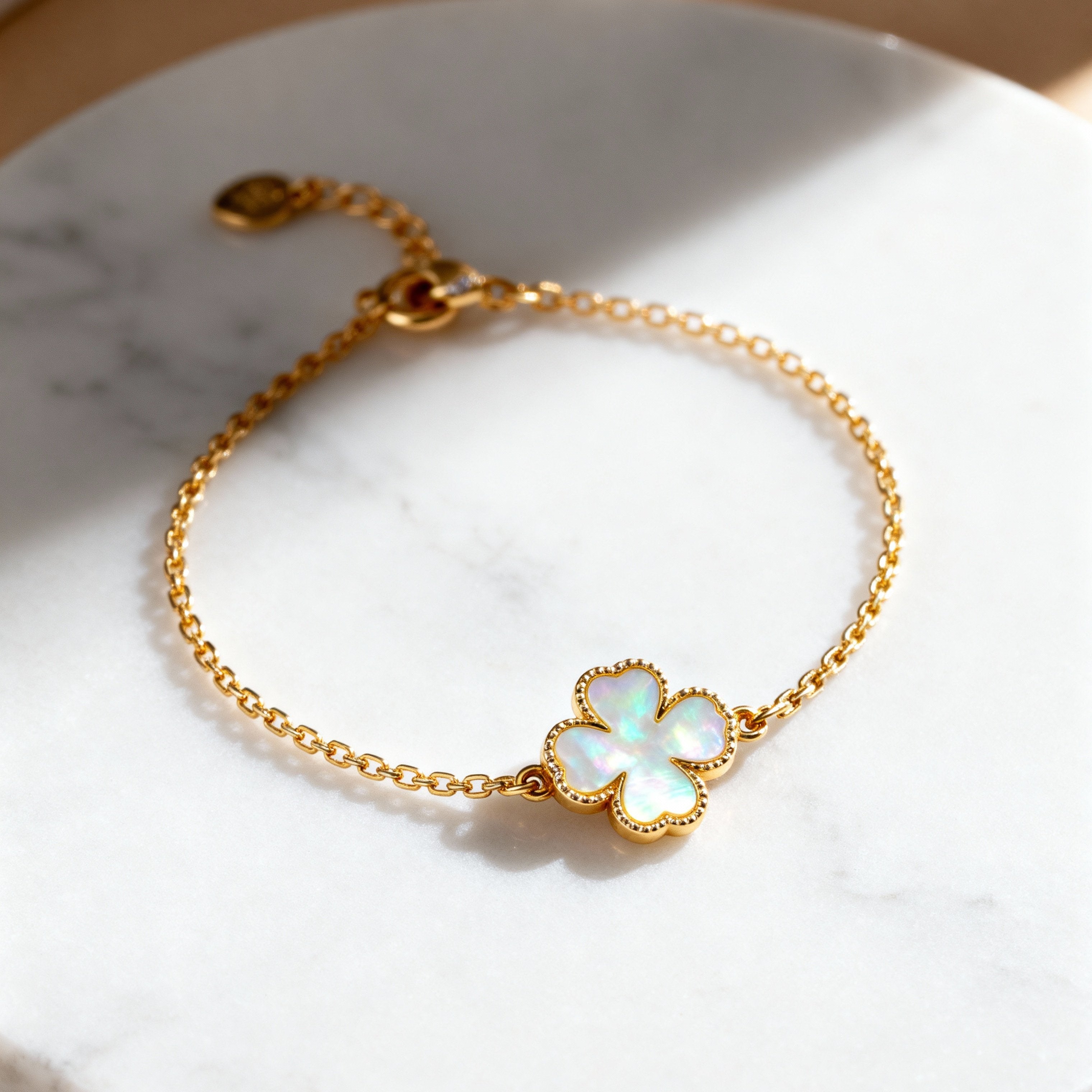 Four-leaf clover charm bracelet
